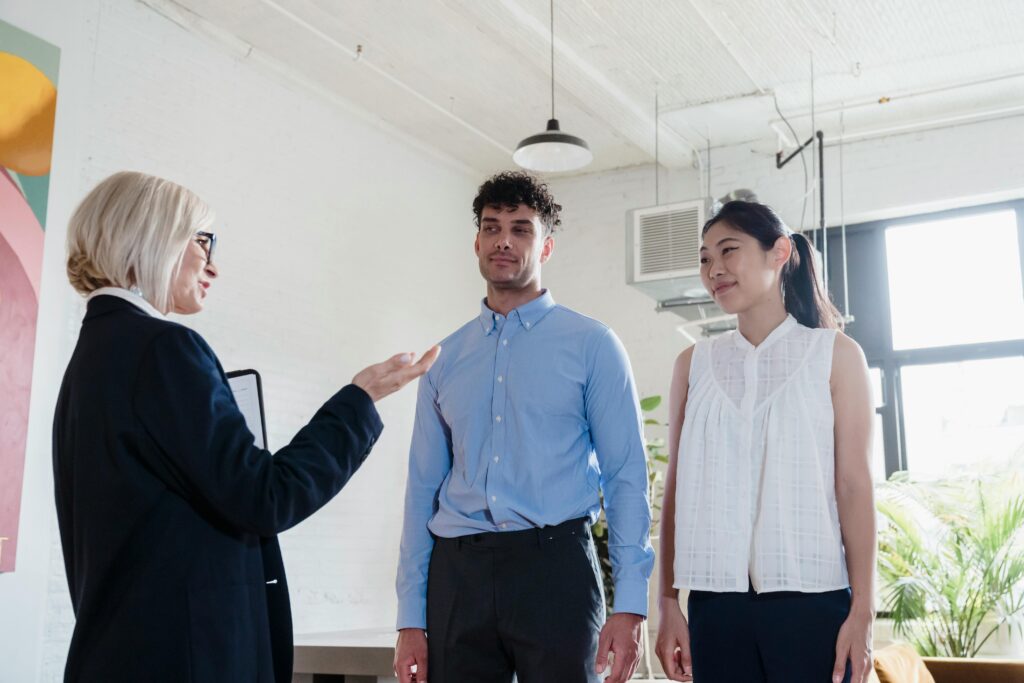 Young professionals talking to a mentor for growth
